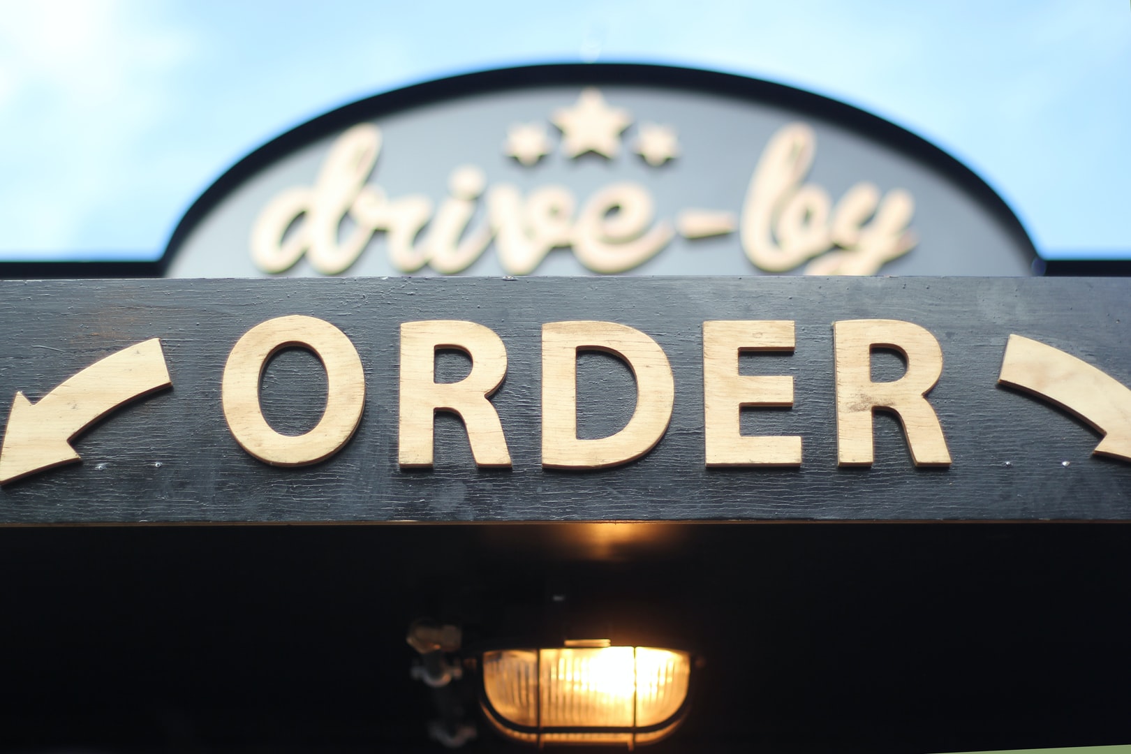 Photo of a sign saying "drive by order"
