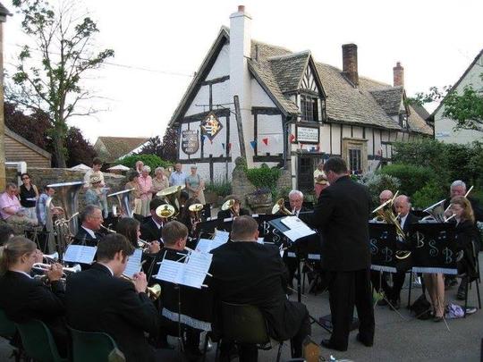 A photo of Bretforton Silver Band playing outside The Fleece Inn